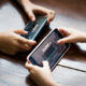 Little boy playing a mobile game against his sister